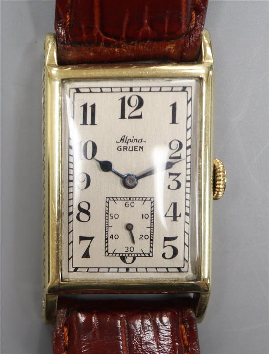 A gentlemans 1930s 14k Alpina Gruen manual wind wrist watch, with rectangular Arabic dial and subsidiary seconds,